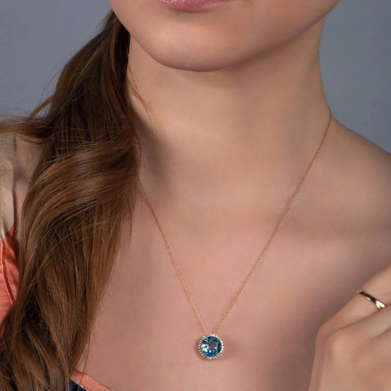 Jewelili 10K Yellow Gold With Round Swiss Blue Topaz and Created White Sapphire Halo Pendant Necklace